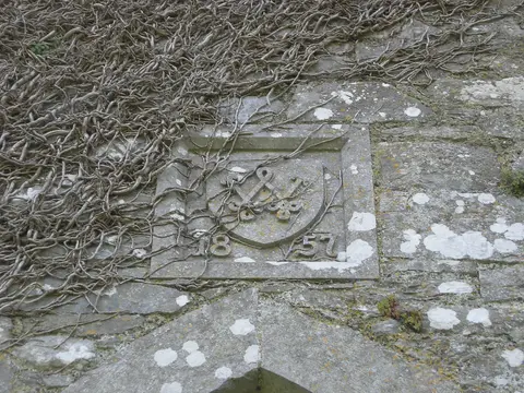 Monogram on east side of Ballincollig Castle tower above entrance. "W" 1857. Co. Cork, Ireland.