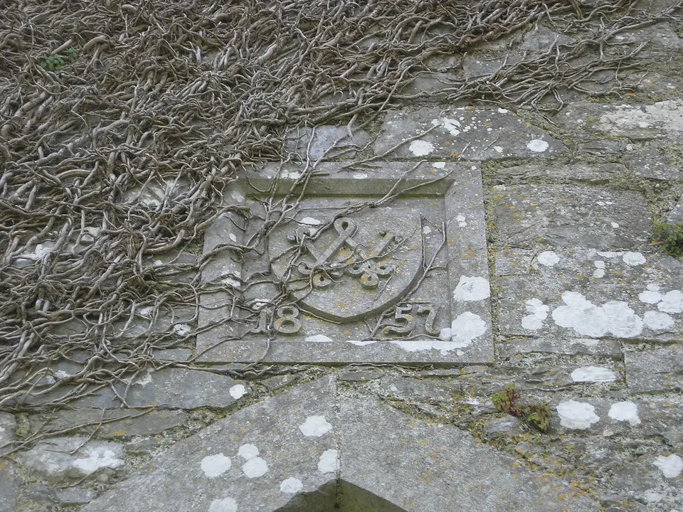 Monogram on east side of Ballincollig Castle tower above entrance. "W" 1857. Co. Cork, Ireland.