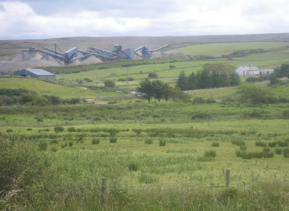 Attractive fields with gravel works in distance