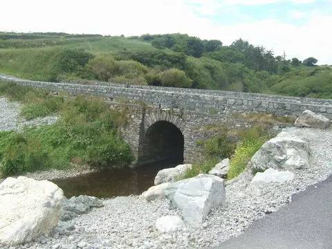 Bridge at Ballyvooney Cove Small water course entering the cove.