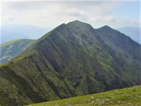 Caher from Carrauntoohil The shapely summit ridge of Caher from Carrauntoohil.