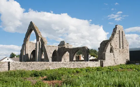 North-west view of the friary with the north transept and its north window on the left and the west gable of the nave.