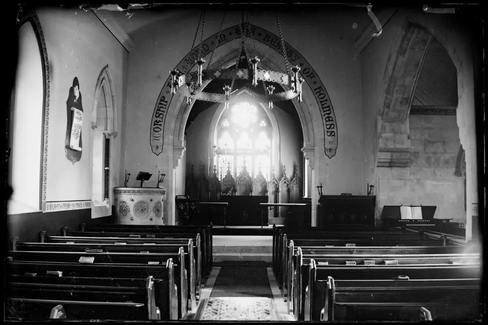 Church interior showing altar and pews. Script over altar reads "Worship the Lord in the beauty of holiness" (38537866921)