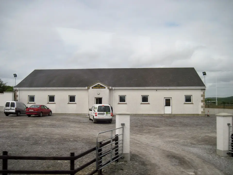 Clubhouse of Naomh Ultan with sportsfield behind. Dunkineely