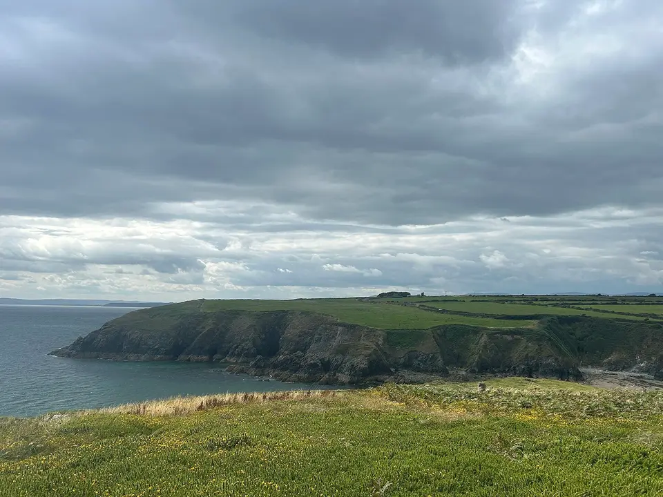 The rugged cliffs and secluded coves of the Copper Coast UNESCO Global Geopark in County Waterford showcase Ireland's rich geological heritage and breathtaking coastal beauty.