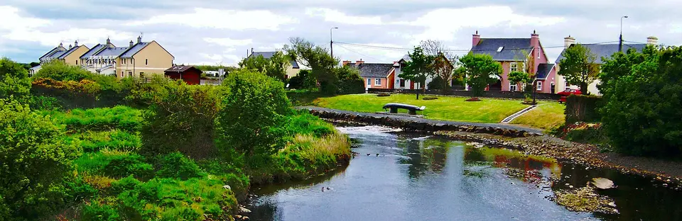 Doonbeg - Main Street (N67) - Stream flowing past Residential Area into Atlantic