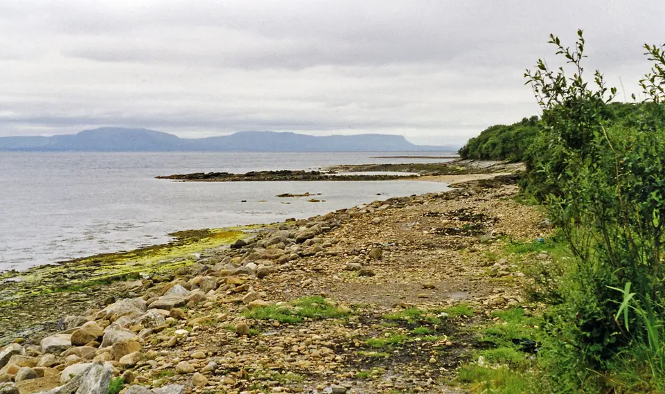 From near Dunkineely on Inver Bay across Donegal Bay to Dartry Mountains. View SW from N56 road.