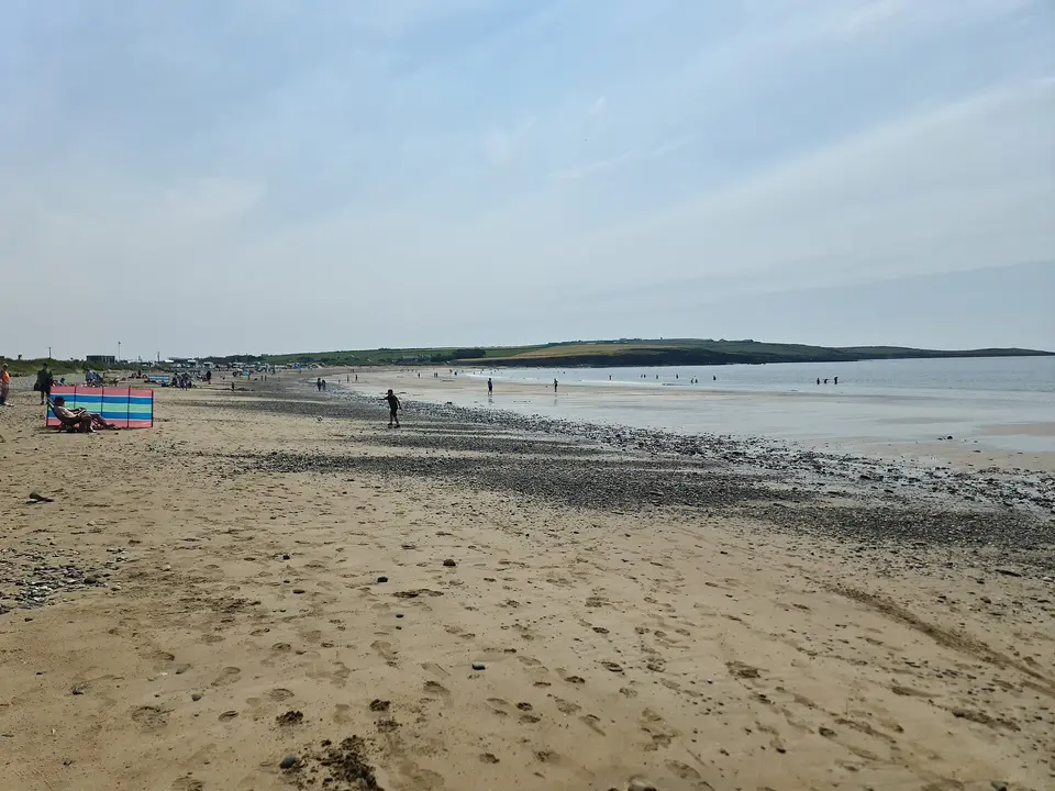 Garrylucas Beach on summer day with crowd of people enjoying the beach