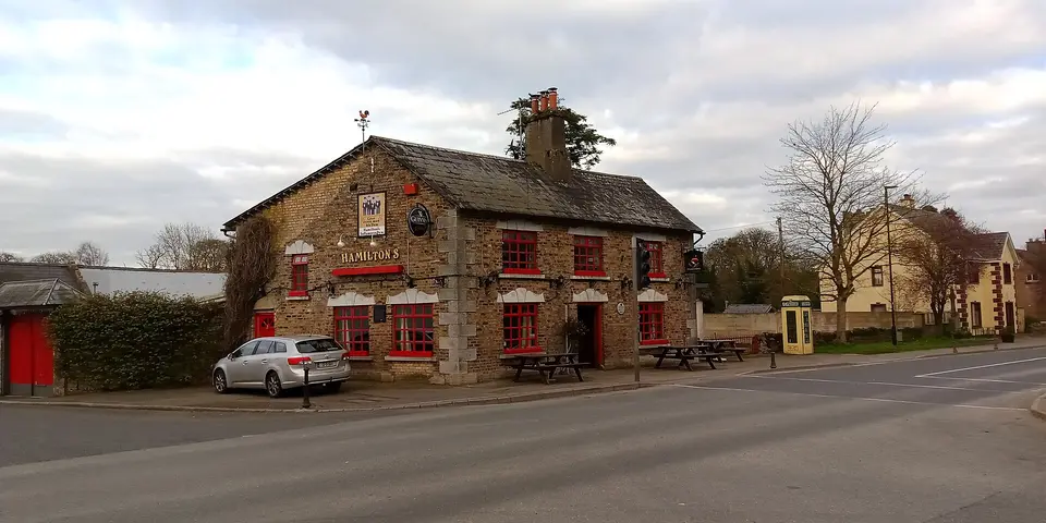 Hamilton's Pub with the window decorations typical for this planned town