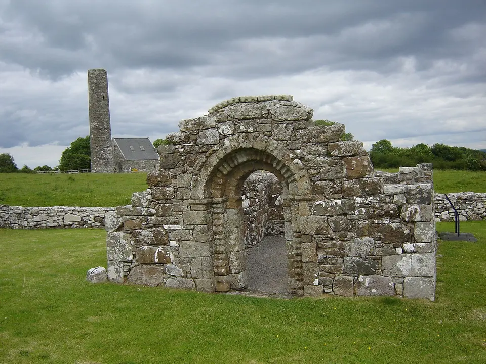 Holy Island (Inish Cealtra), Lough Derg, near Mountshannon in County Clare, Ireland. Ruins of St. Brigid's Church with Romanesque archway, St. Caimin's church in the background.