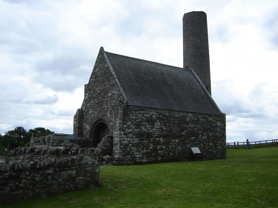 Holy Island (Inish Cealtra), Lough Derg, near Mountshannon in County Clare, Ireland. St. Caimin's Church, the main church on the island, with Round Tower.