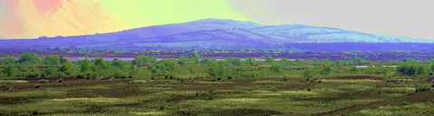Severely enhanced vision of Croghan Hill rising from the Bog on Allen in County Offaly, Ireland