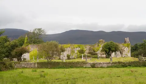 South range of Killagh Priory with the Slieve Mish Mountains in the background.