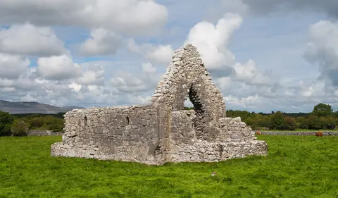 St. John the Baptist's Church, located between Kilmacduagh Cathedral and the glebe house.