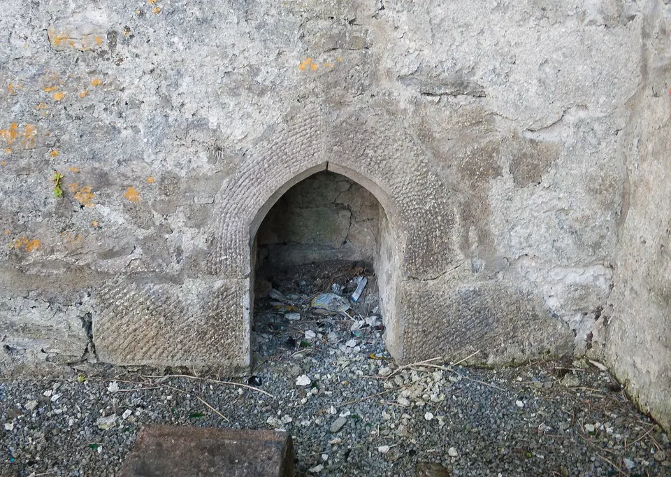 Piscina in the east wall of the south transept.