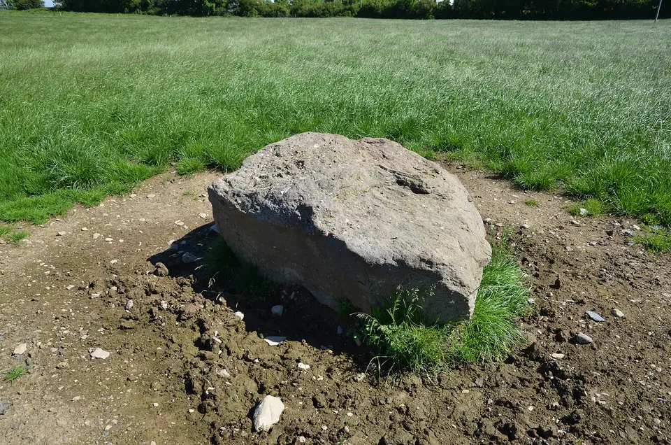 The now recumbent standing stone at Kilmogue, in the adjacent field to Kilmogue Portal Tomb