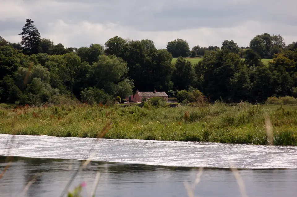 Lower Ballyellen lock keeper's house as seen from near the weir in the Barrow River.