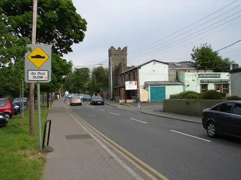 Monastery Road and Tulley's Castle A range of shops is situated unseen to the left of the picture.