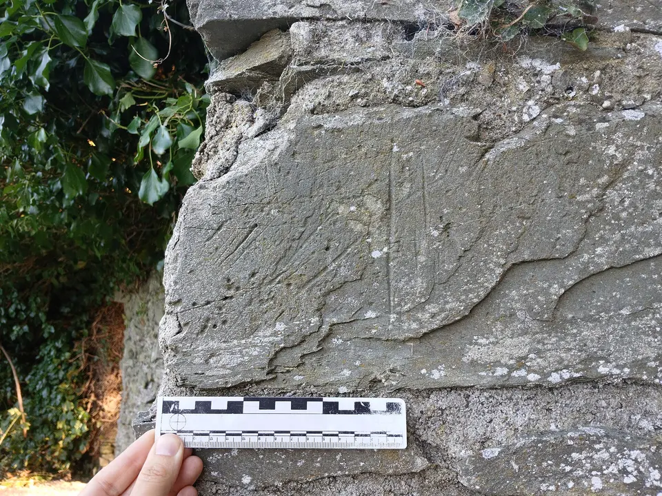 Moone Abbey grooves exterior east wall