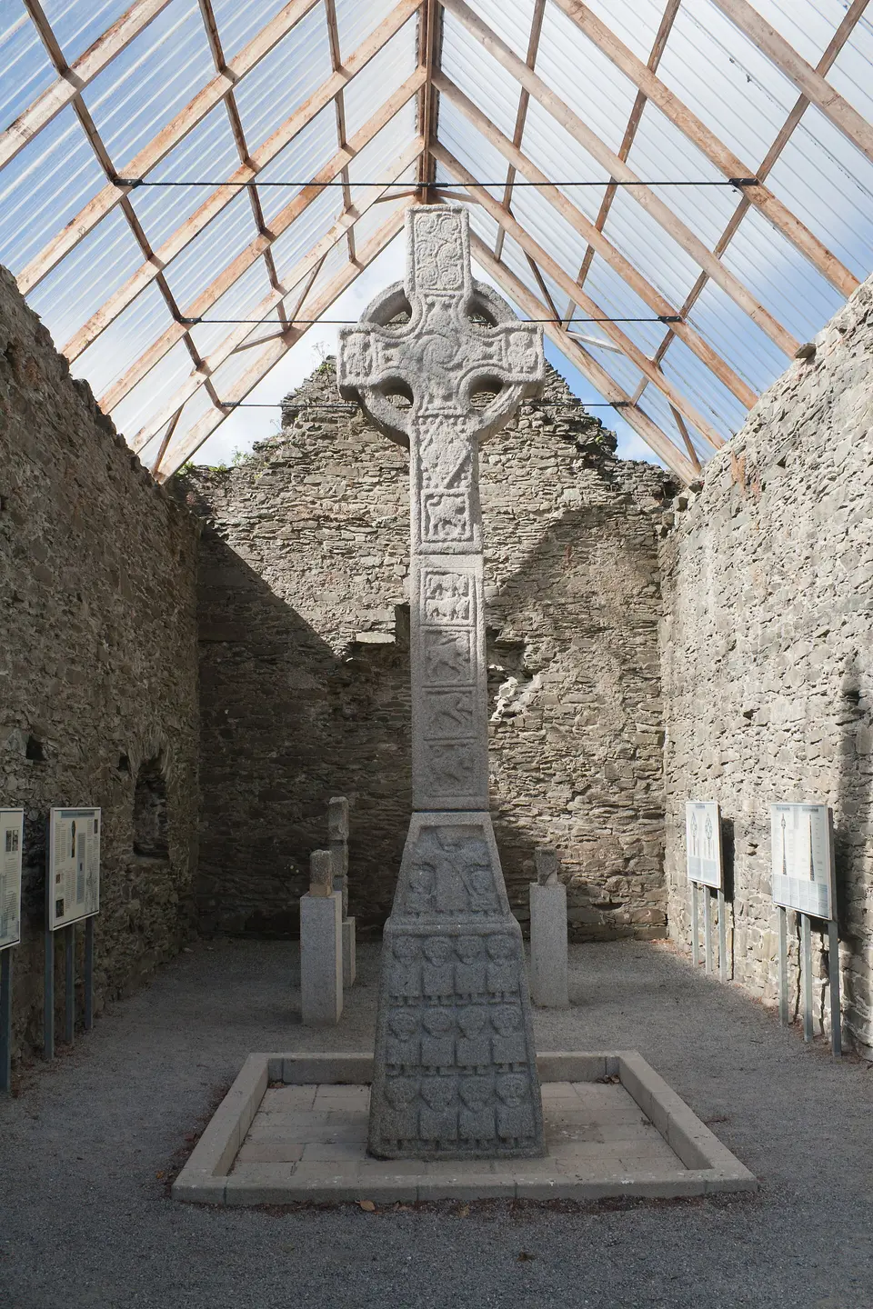 East face of the tall cross of Moone (was formerly the west face before the cross was moved into the walls of the old church under the protective roof.