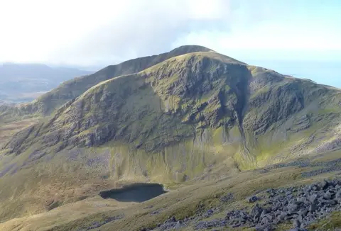 Mweelrea from Ben Lugmore, showing its northern corrie lake of Lough Bellawaum (the southern corrie lake of Lough Lugaloughan is obscured by the spur). Mayo, Ireland