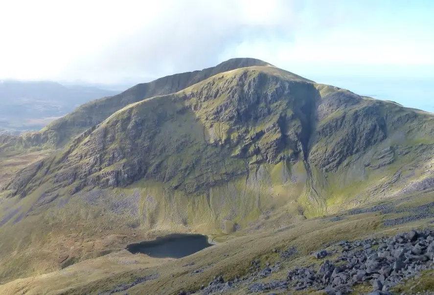 Mweelrea from Ben Lugmore, showing its northern corrie lake of Lough Bellawaum (the southern corrie lake of Lough Lugaloughan is obscured by the spur). Mayo, Ireland