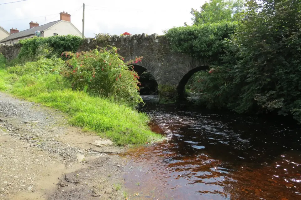 Cabry River - view downstream (southeast) at three-arch stone road bridge at Carrowkeel.