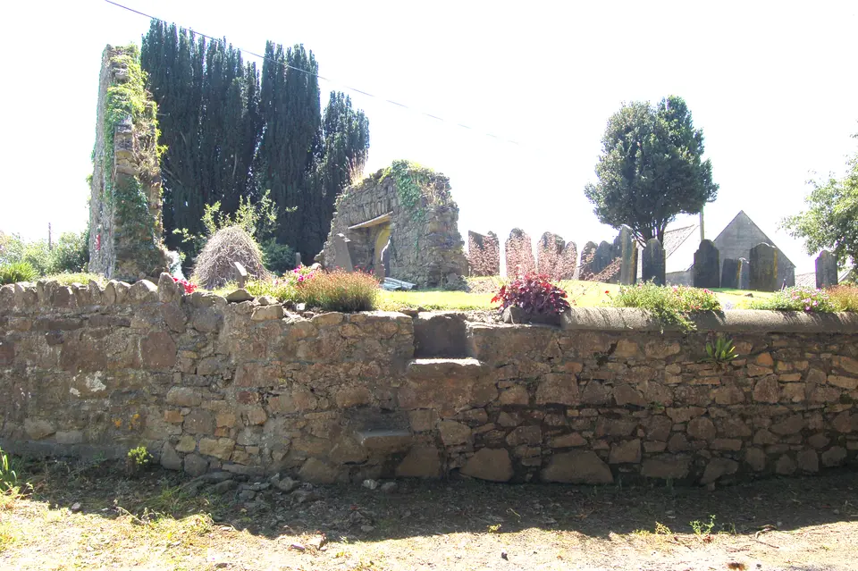 Portnascully Graveyard and Church ruin with a step over stile leading up into the graveyard. National monuments no. KK045-002002.