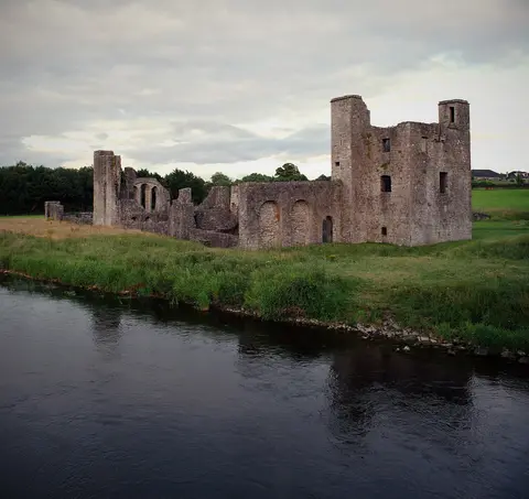 The main building complex at St. John's Priory, as viewed from Newtown Bridge. The large tower house at right is a later defensive tower, which post-dates the hospital and priory.