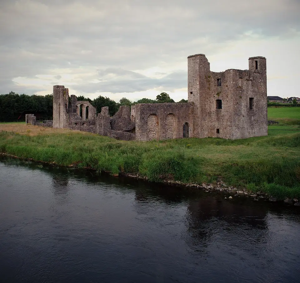 The main building complex at St. John's Priory, as viewed from Newtown Bridge. The large tower house at right is a later defensive tower, which post-dates the hospital and priory.