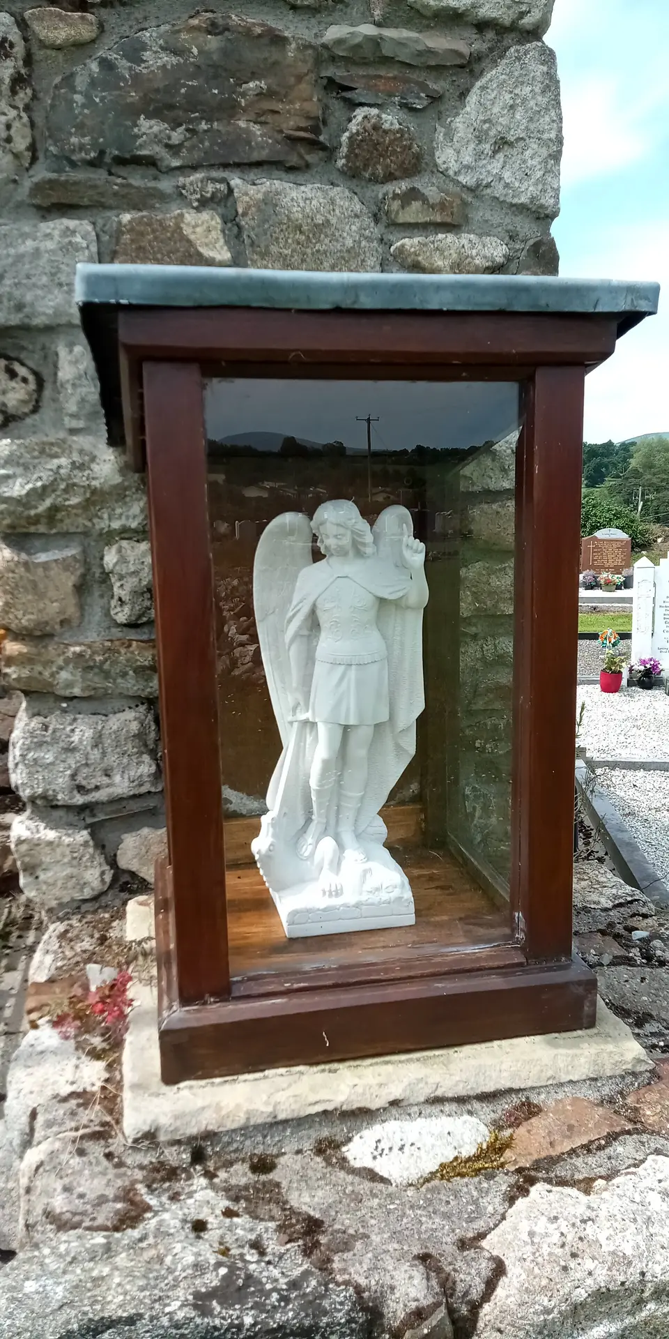 statuette of Saint Michael at Saint Michael's Church (church ruin in Tinnahinch, Co. Carlow)