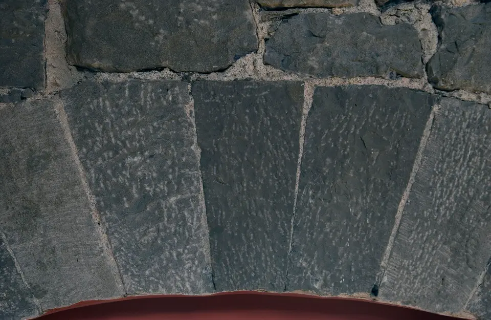 Detail of coursed limestone of window arch from interior of Cregg Mill, Galway, Ireland