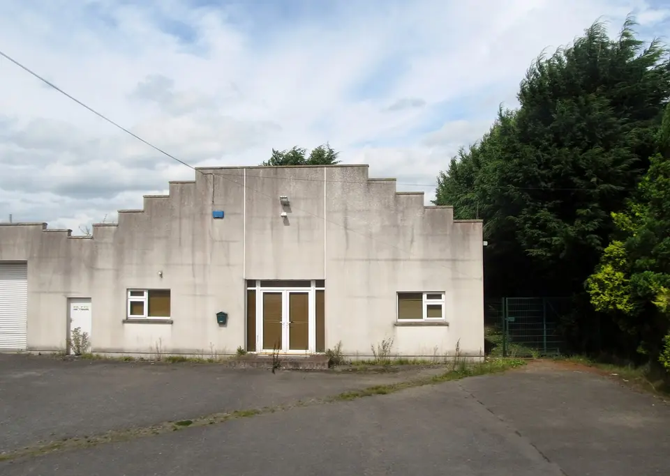 The offices of J P Castle, Builders, alongside the R171 between Knockbridge and Dunbin