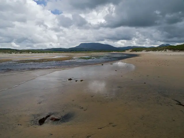 The Ray River at Errarooey beach With Muckish Mountain in the distance.
