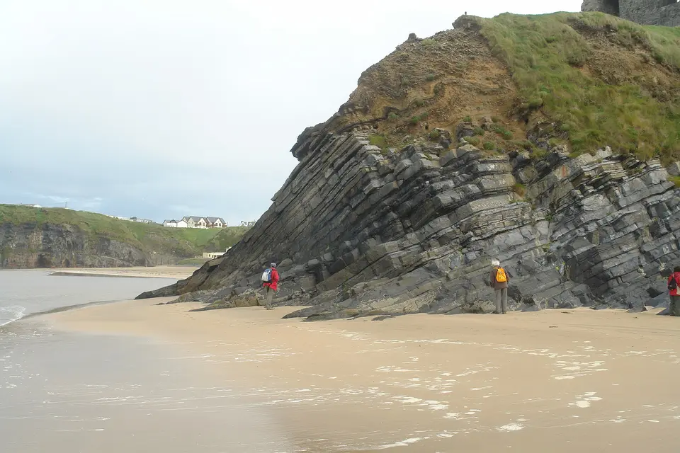 Tilted layers of limestone and mudstone, of Carboniferous age, on the beach at Ballybunion in Ireland.
