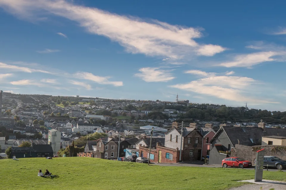 Cork's rooftops and church towers from the green slopes of Bell's Field.