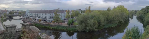 Riverside buildings reflected in the River Nore in Kilkenny.