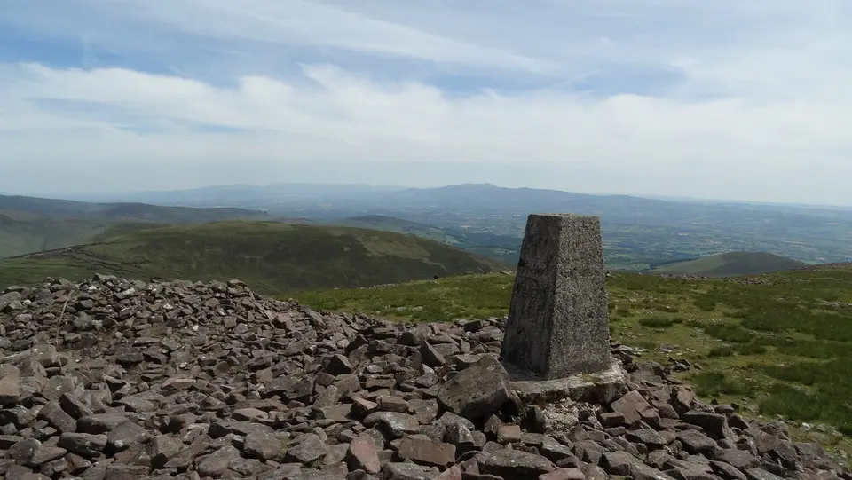 Trig point on Temple Hill with view towards Knockmealdown Mountains