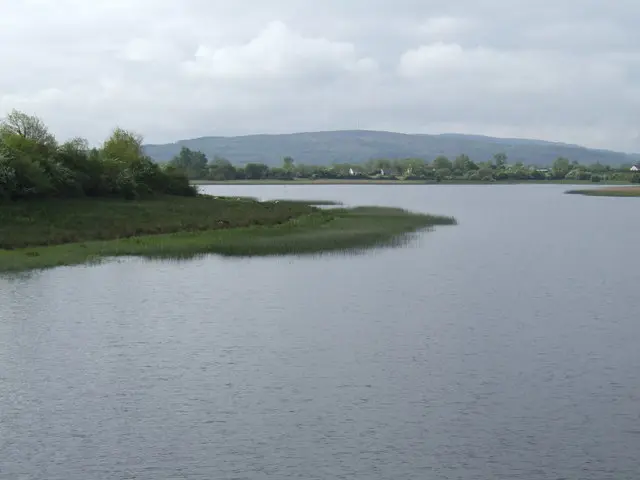 Upper Lough Erne View south from the viaduct onto Inishnore. The dome of Slieve Rushen is in the distance.