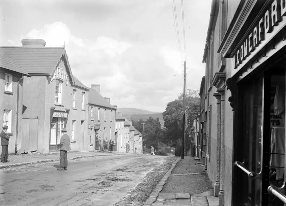 View of a village street, with pedestrians, in an unidentified location = Rathdrum, Co. Wicklow! (8453130686)