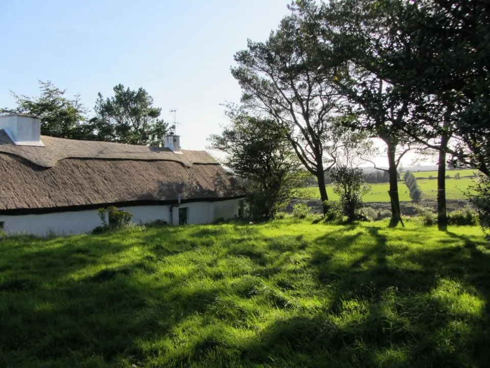 View south-west to Mick Moore's Cottage and fields beyond