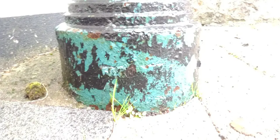 worn maker's mark on sewer ventilation pipe along Moate Street, made by Tonge & Taggart in Dublin. Crowling missing.