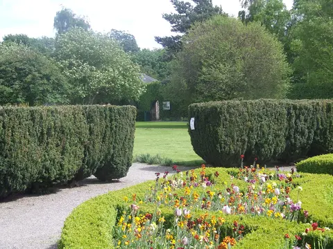 The formal garden of the Pearse Museum, Rathfarmham. Yew hedge encircles a fountain.
